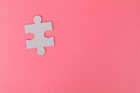 jigsaw puzzle on pink background